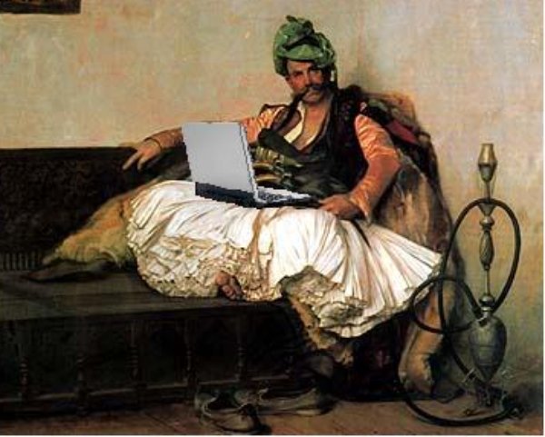 a man with a laptop sitting on a bench