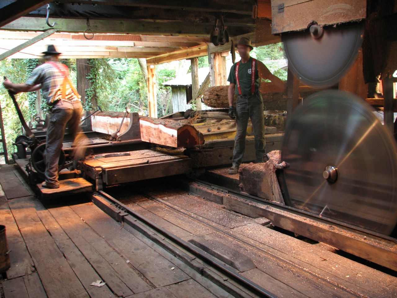 two men are working in an industrial factory