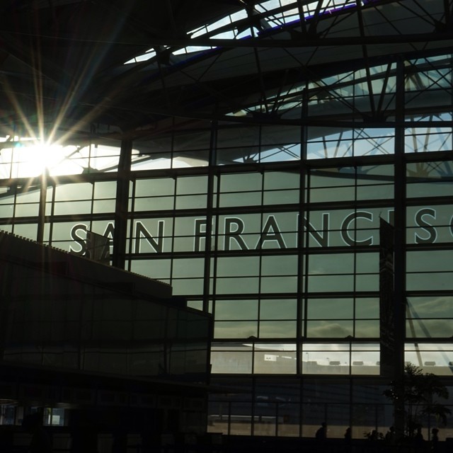 sun peeks through the windows of an airport