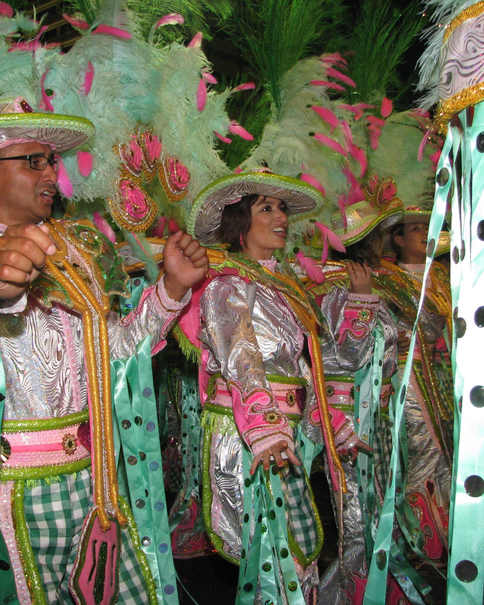 men and women in colorful costumes and hair
