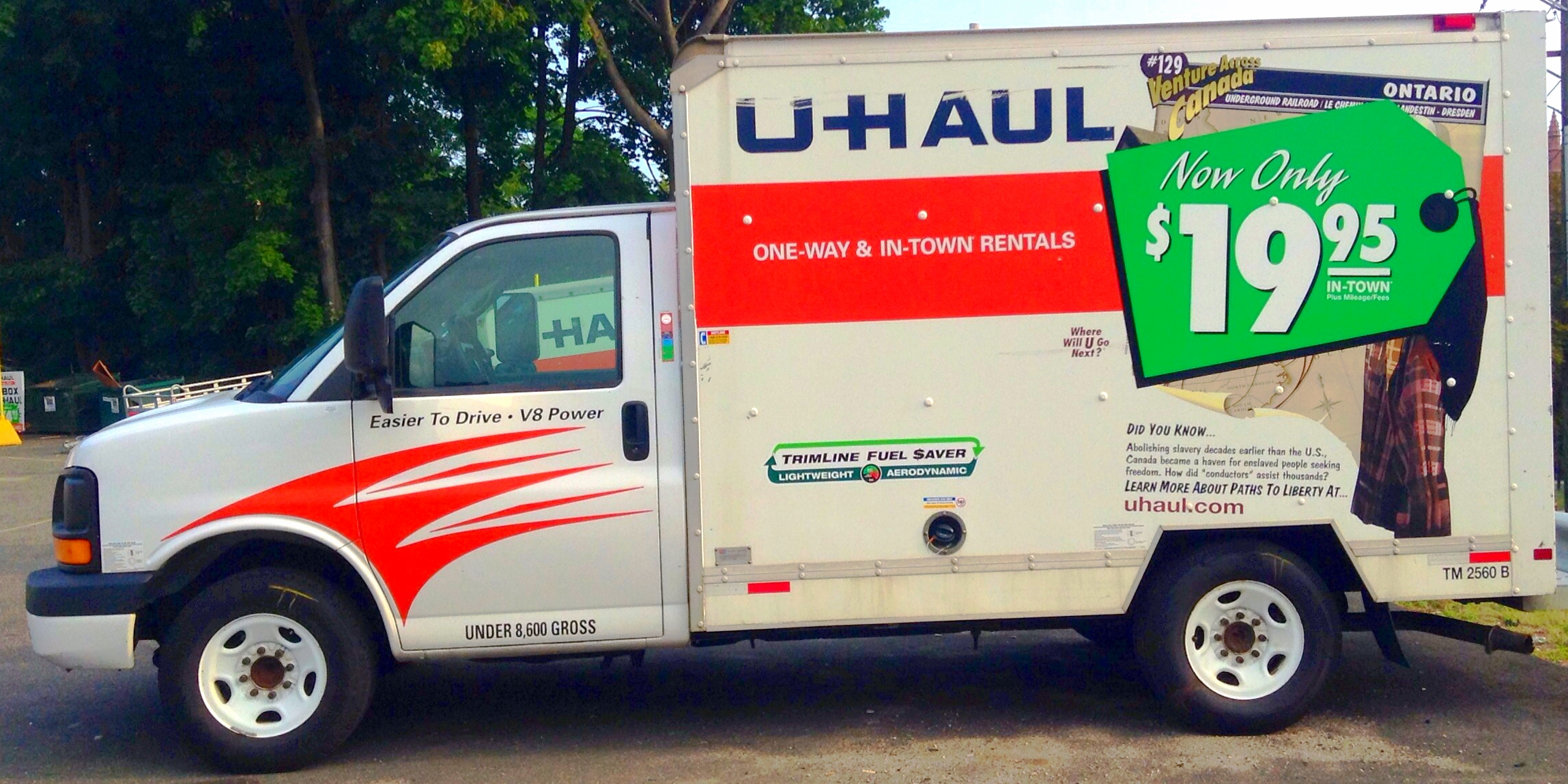 a utility truck for u - haul is parked in a lot