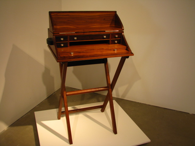 a desk made with a wooden frame and drawers