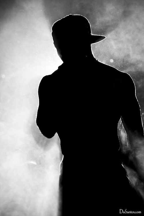 the man with hat in the shadow in black and white