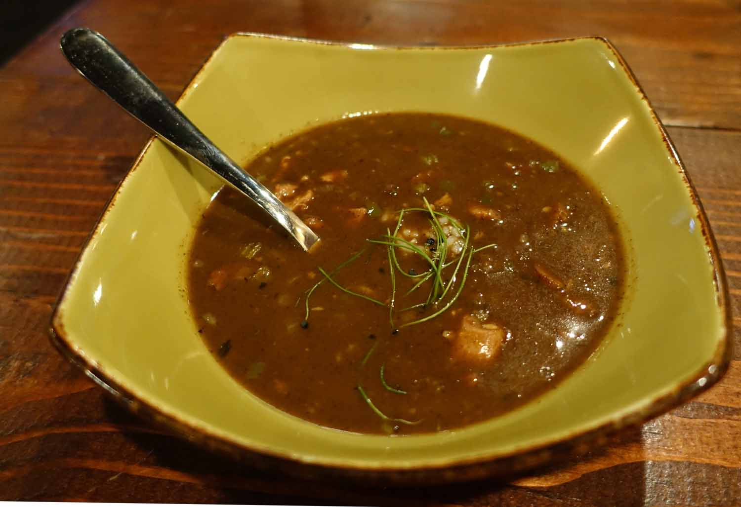 a large, soup type food with beans and vegetables