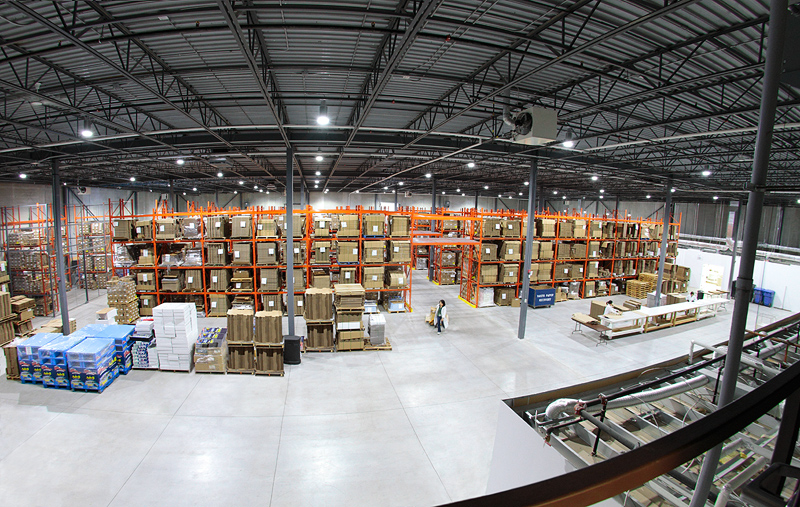 the inside of a warehouse with many shelves