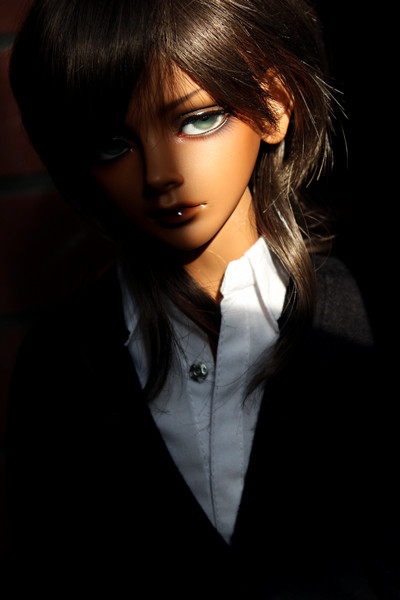 the doll is posed in a very dark fashion