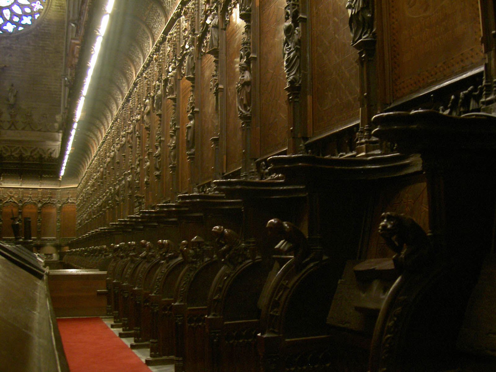 a row of ornate wooden staircases in a church