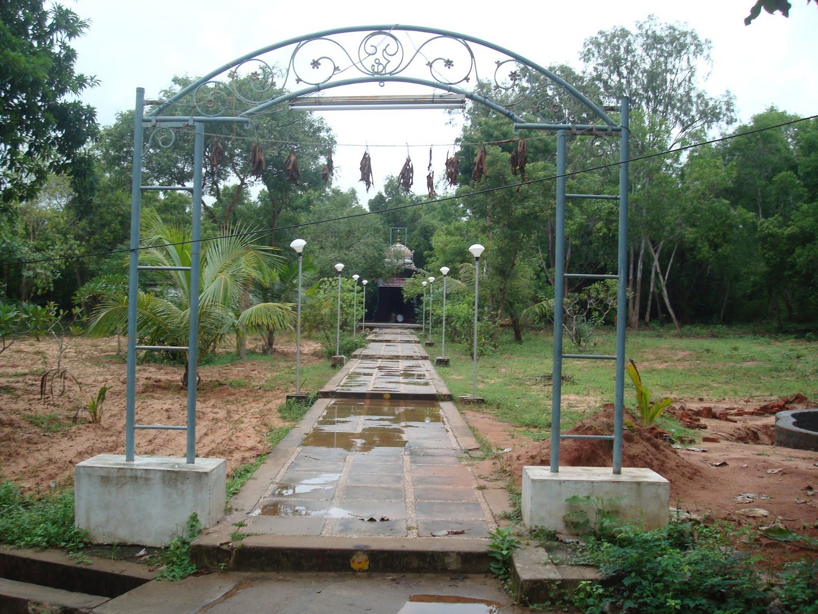 an open archway leads to the garden and a path