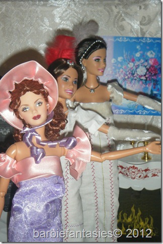 dolls dressed in white, pink and purple clothes standing next to each other