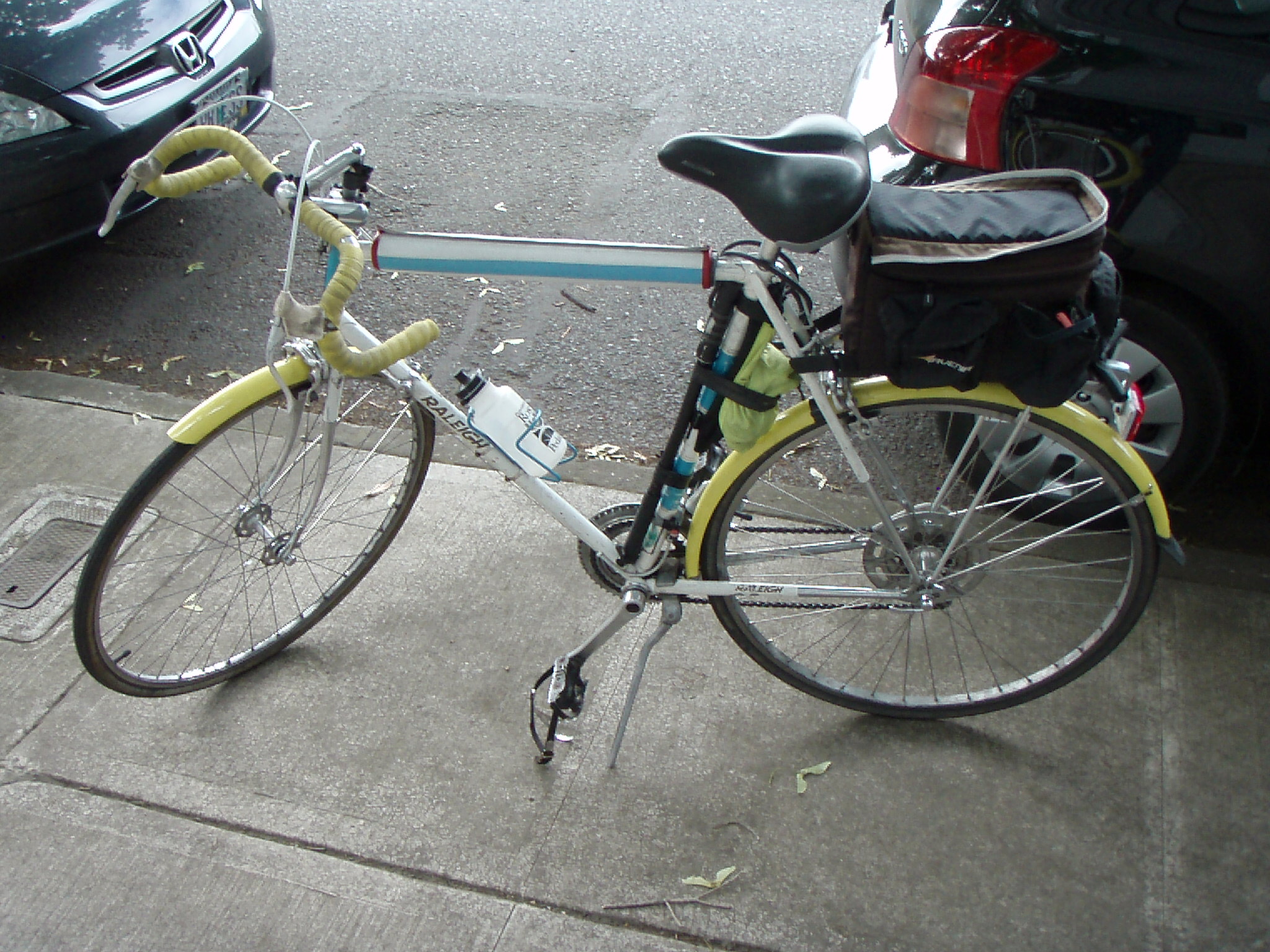 there is a bike parked on the sidewalk