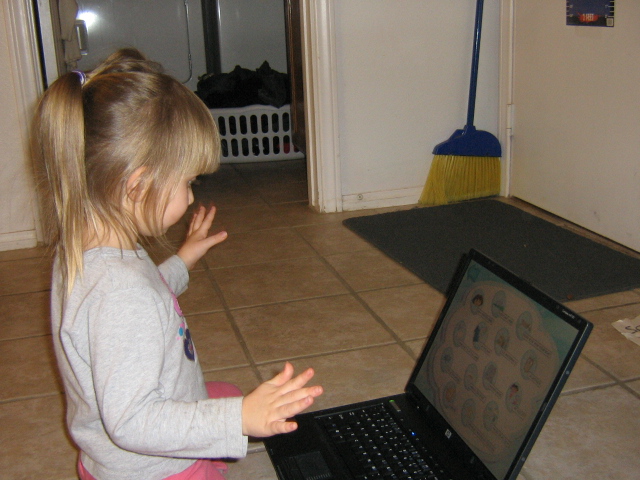 a  using a laptop computer in her home