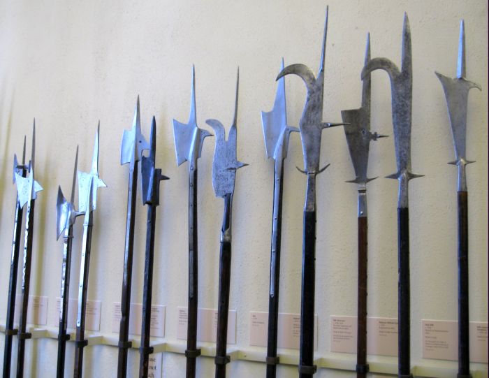 a large collection of metal weapons and arrows