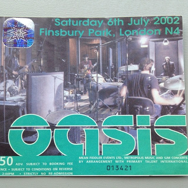 a magazine called oasis featuring an image of band members