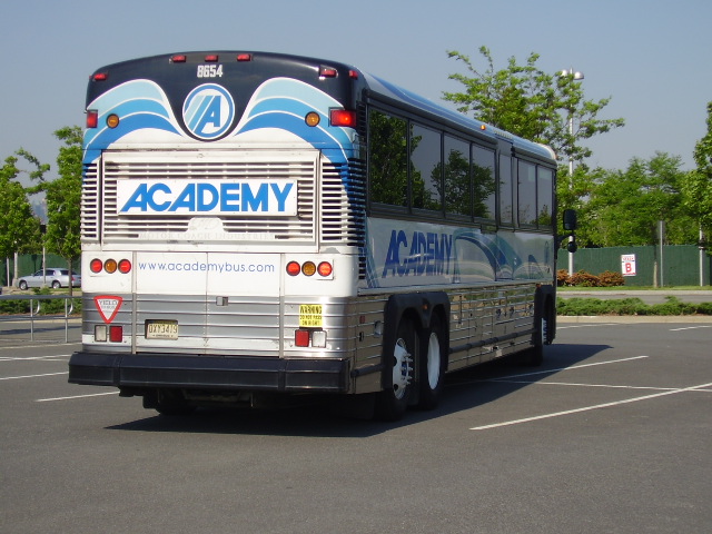an exterior view of a bus in a parking lot