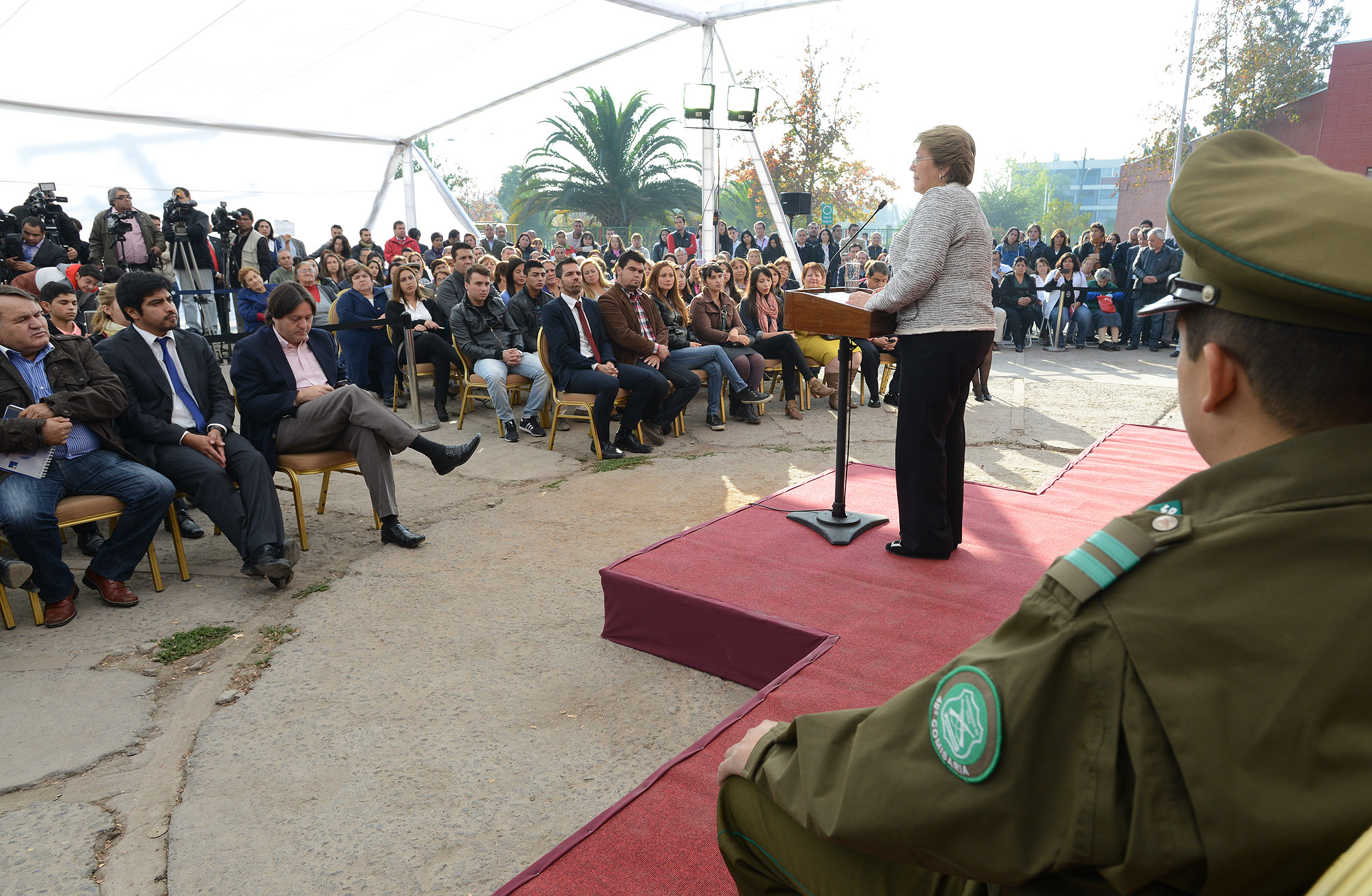 a woman talking in front of an audience