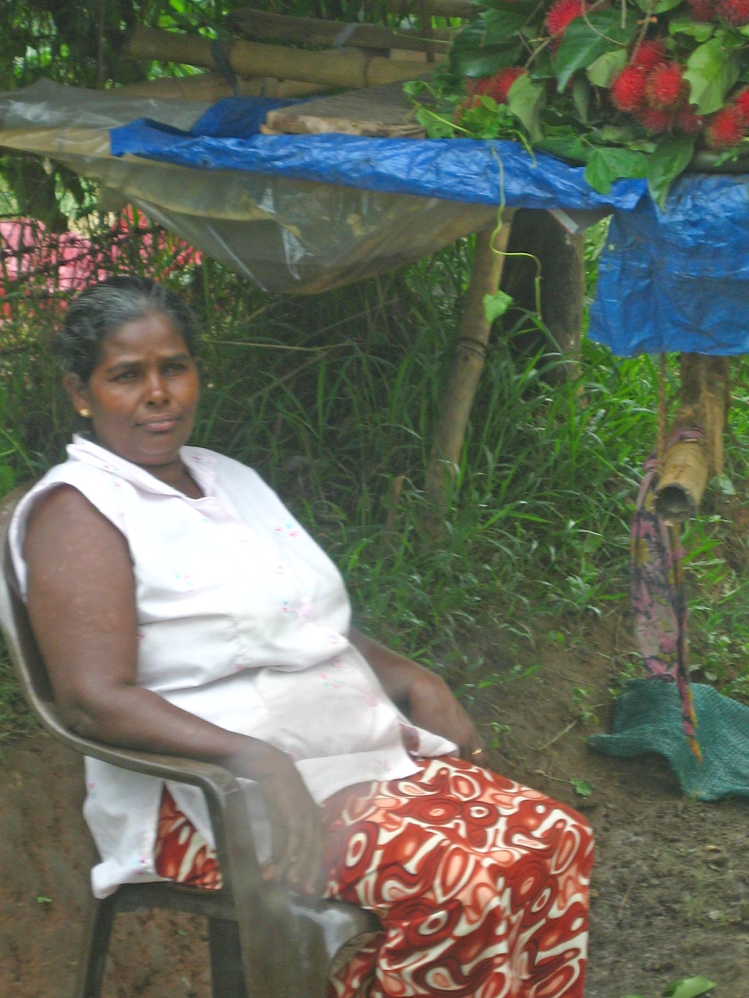 a woman sitting on top of a wooden bench