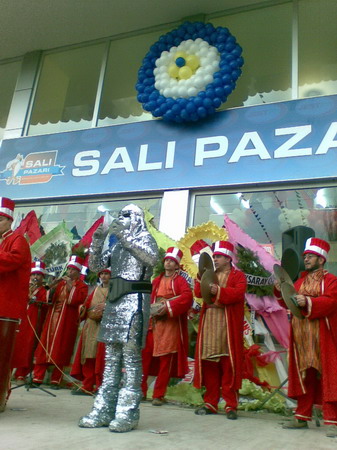 people are dressed in costumes and standing in front of a building