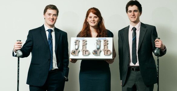 three people posing for a picture in suits and ties