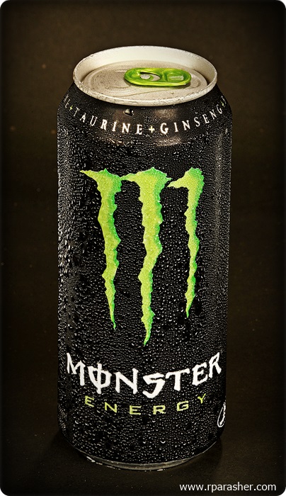 a can of monster energy drink on a table