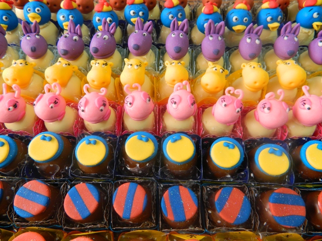a display of candy with colorful toy animals