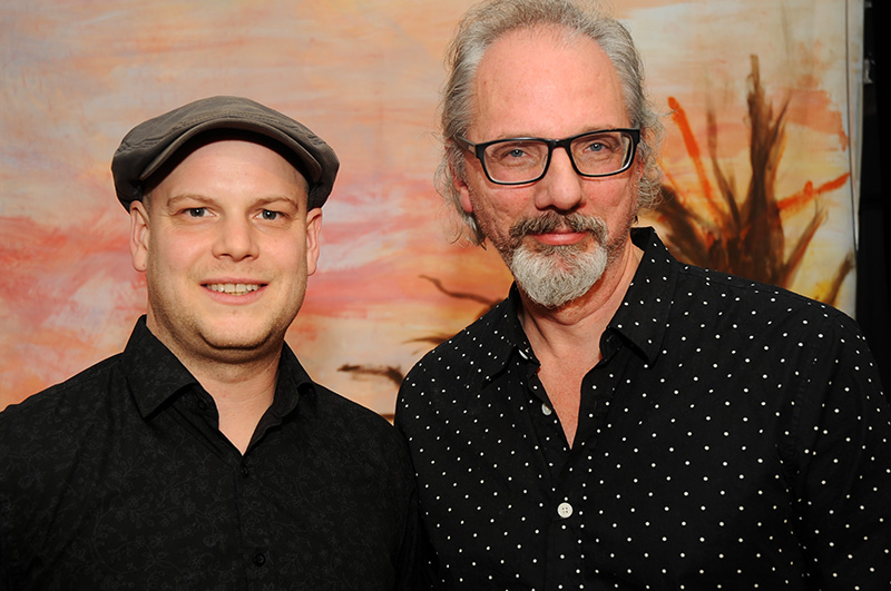 a couple of men posing for a picture