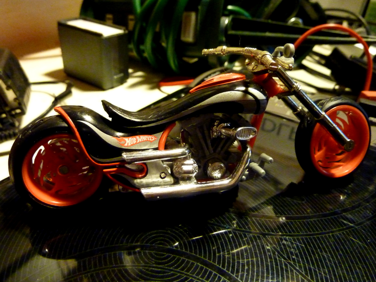 a toy motorcycle is on top of a desk