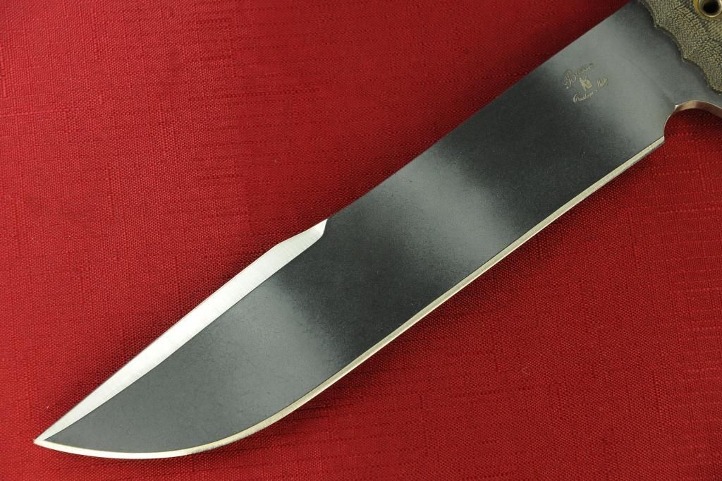 an image of a knife that is on a red cloth