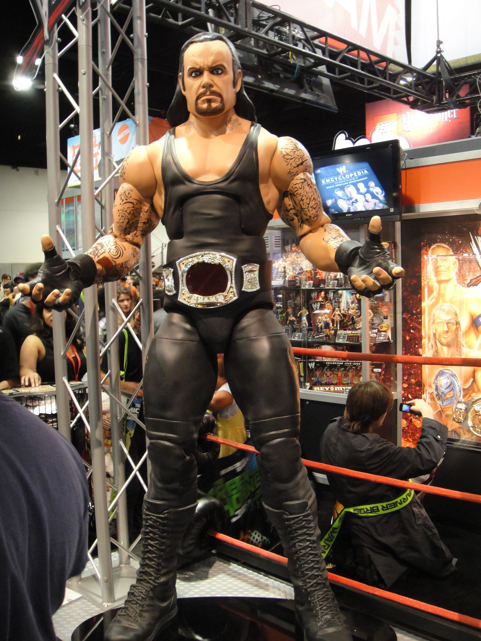 a statue of wrestler standing on a wrestling ring
