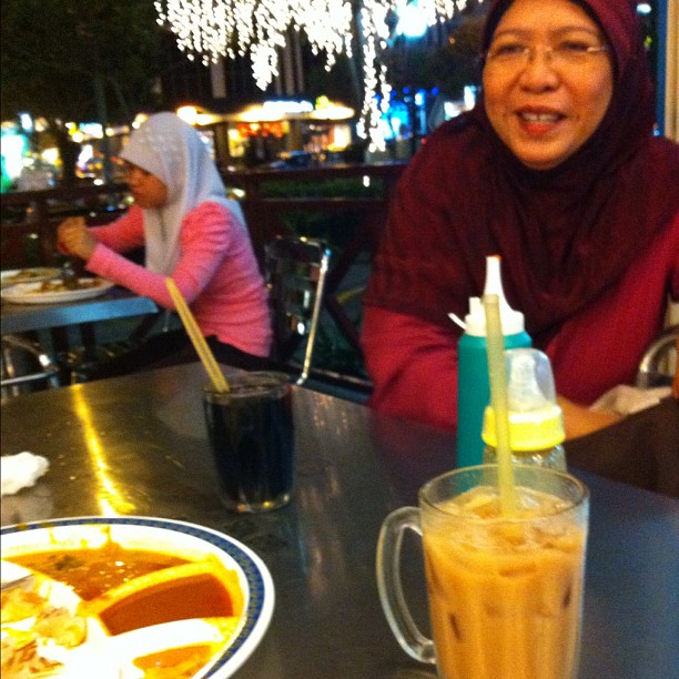 a woman at the table with some food on it