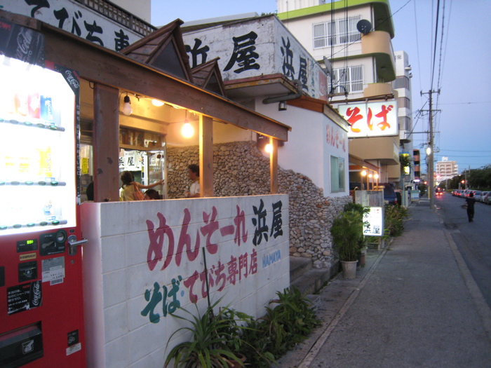 a food stand in a asian country with chinese writing