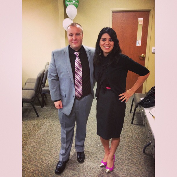 two business people standing in front of a door