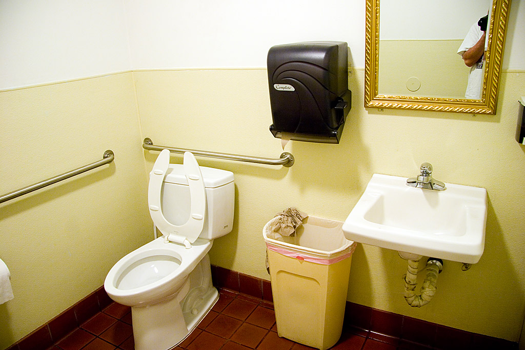 a bathroom that has a mirror and sink inside