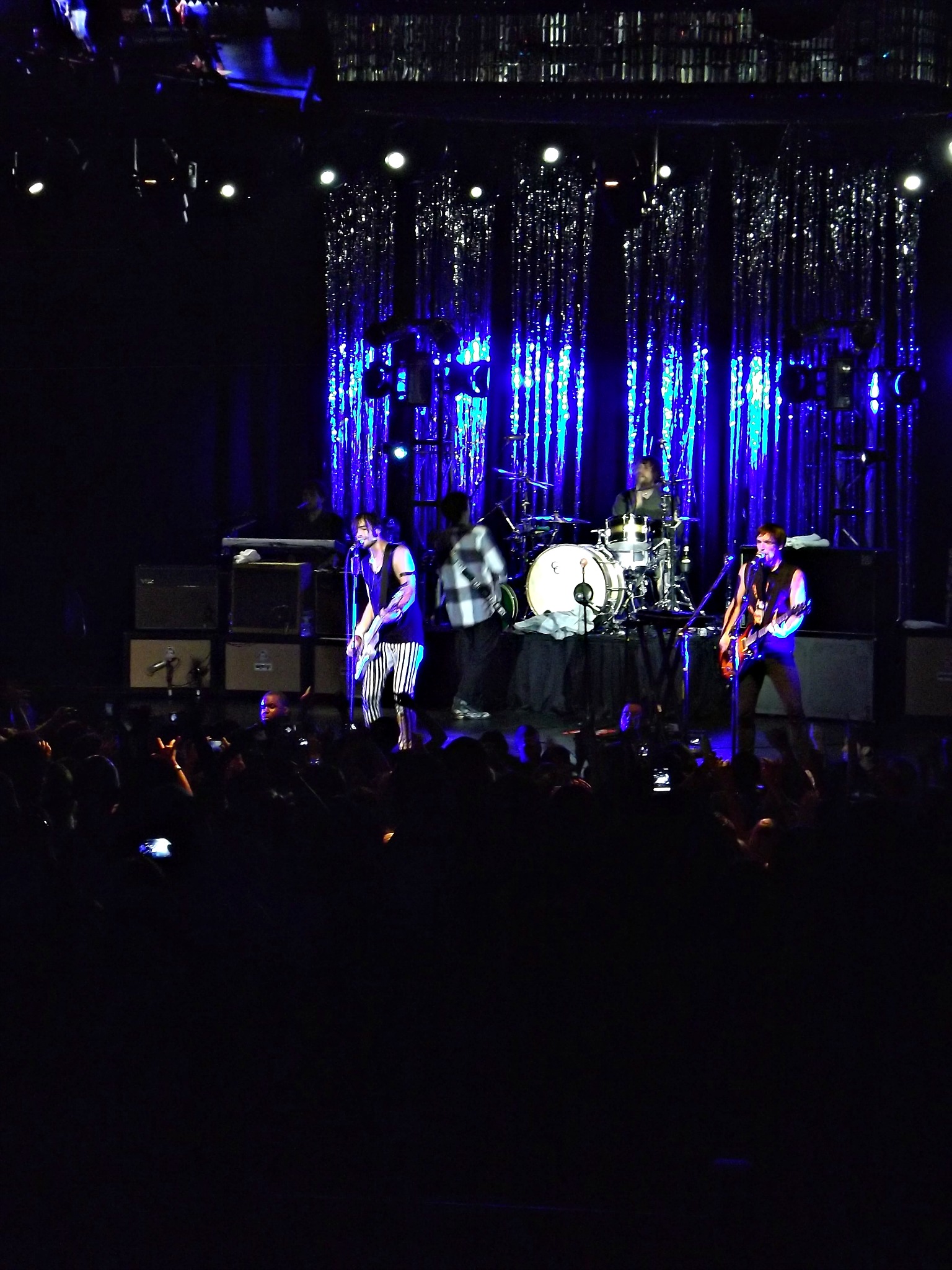 a group of people on stage playing instruments