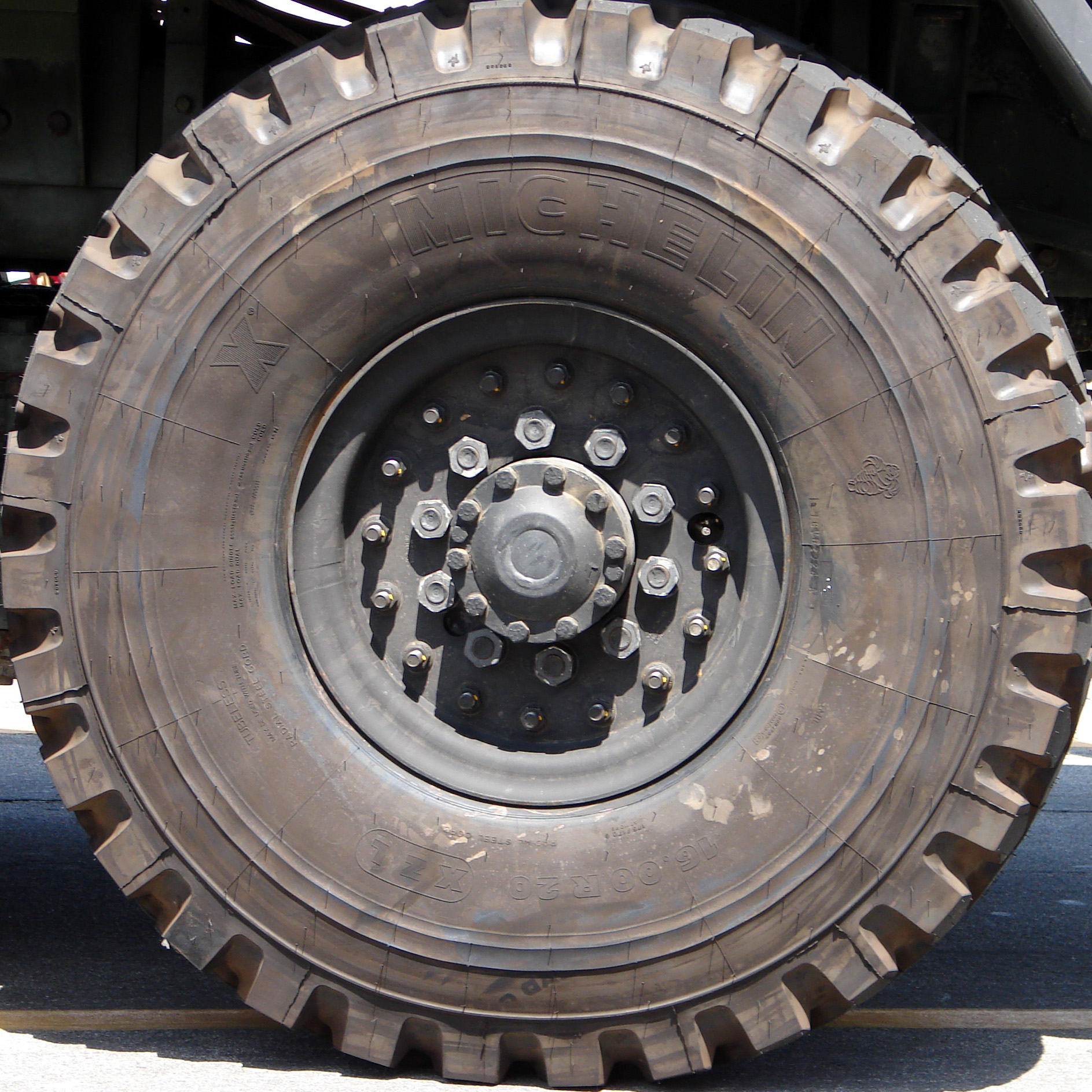 a tire is shown on a truck parked in front of a house