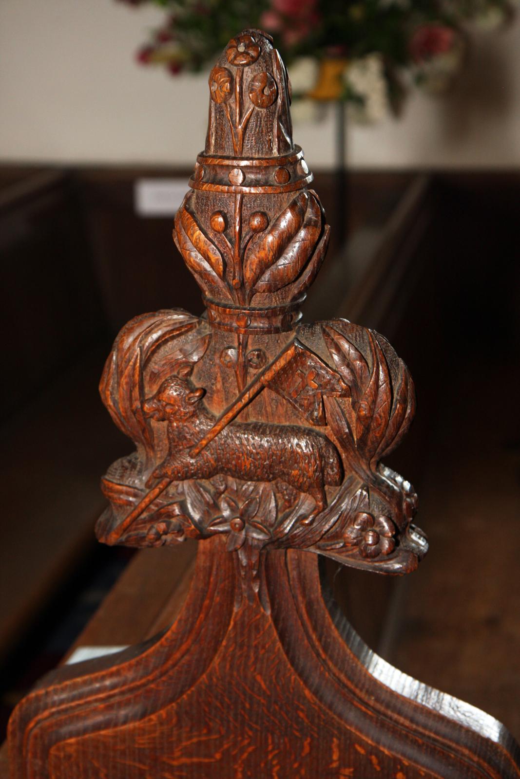 a wooden clock on top of a glass table