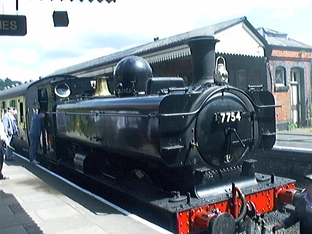 an old locomotive train is on display at a train station