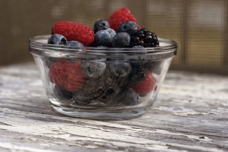 a bowl of mixed berry, raspberries and blueberry