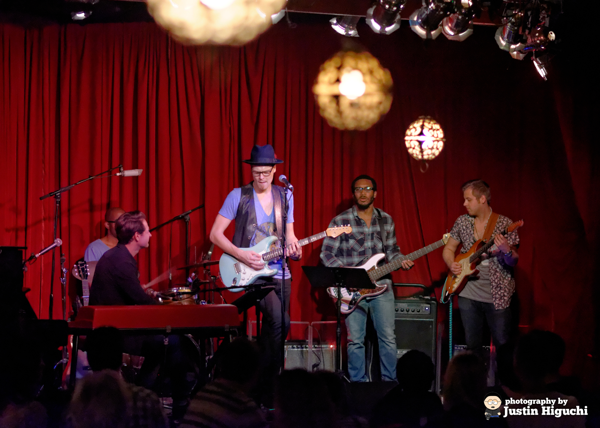 a band playing music in front of a crowd