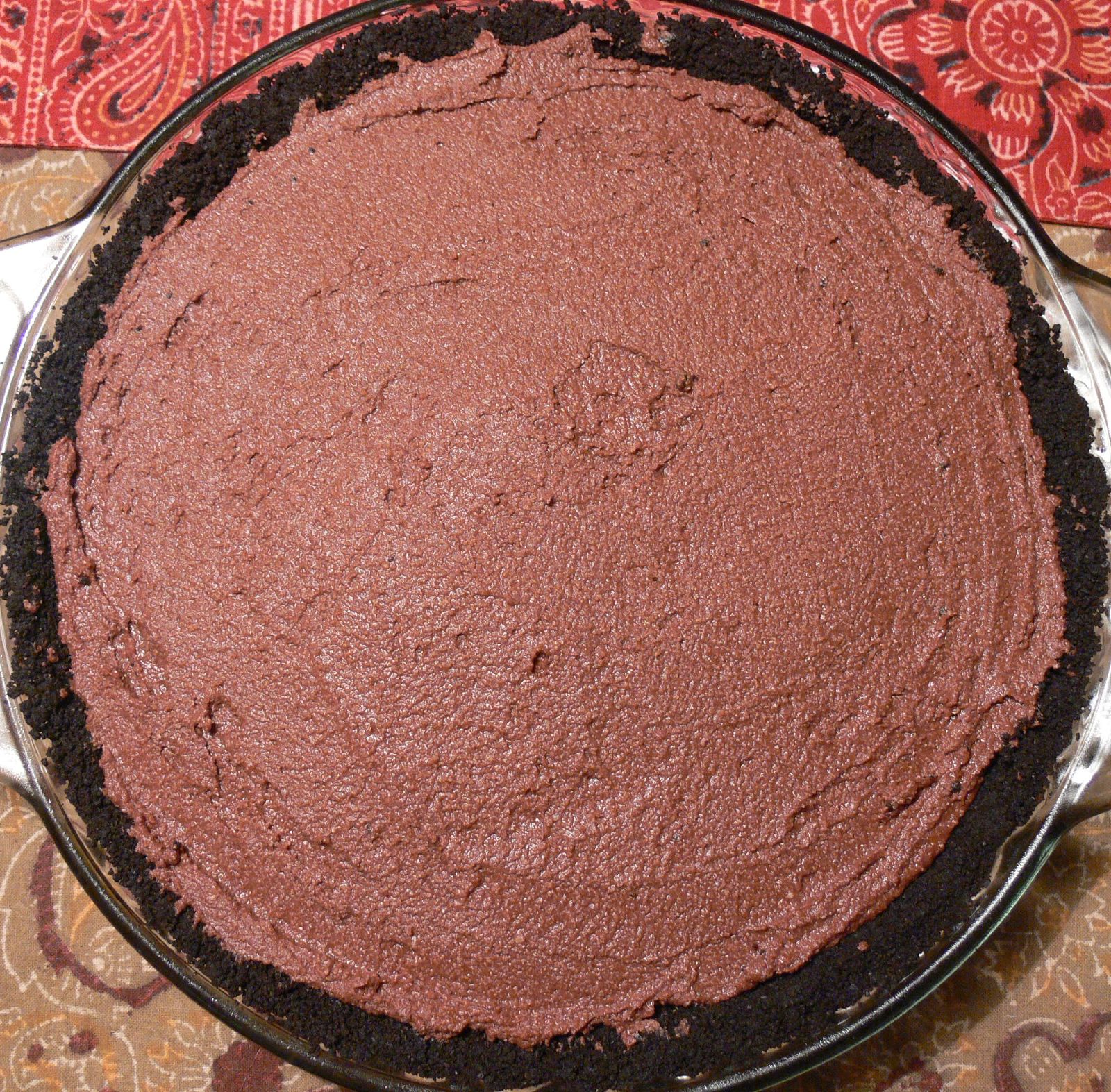 a pie crusted, ready to be served on a table