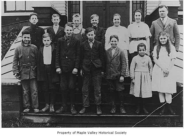 an old pograph of children on a porch