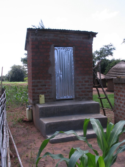a brick house with a metal door