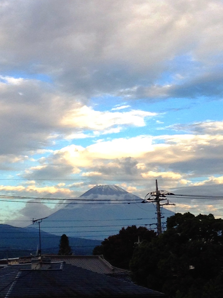 mountains and wires on the horizon and clouds in the sky