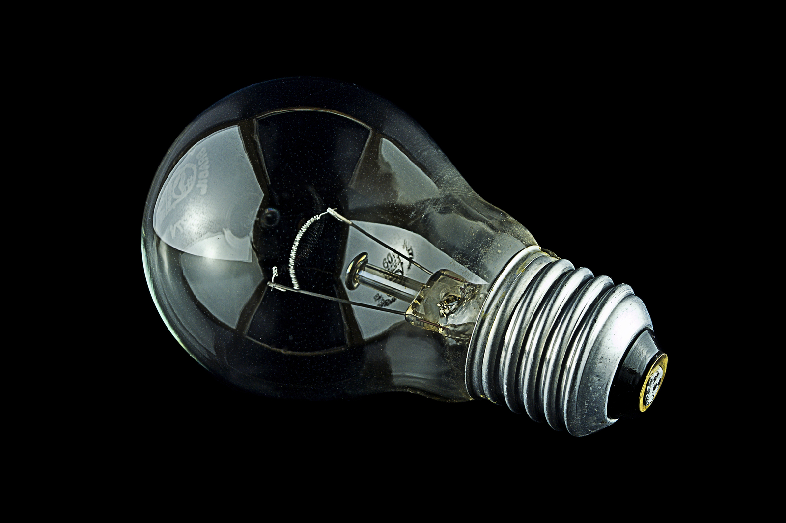 an extremely dark light bulb showing its energy potential
