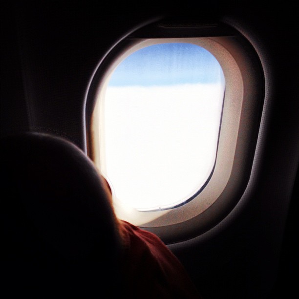 view of a airplane window while flying