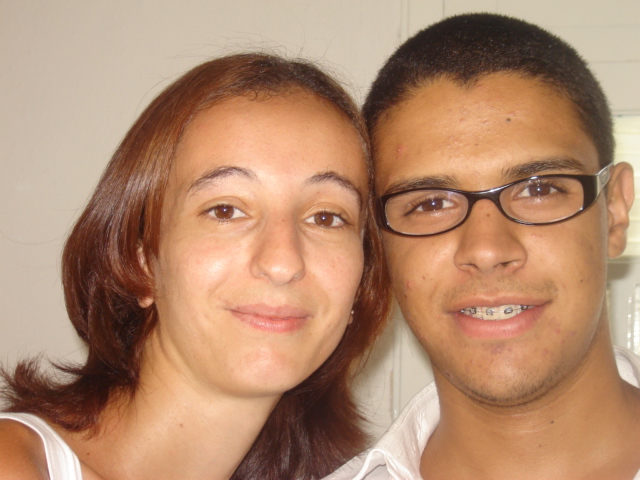 two people smile for the camera as they pose for a picture