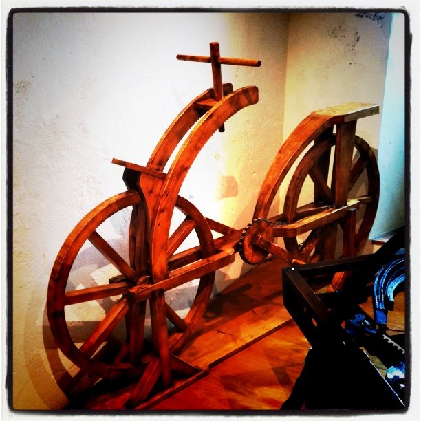 a pair of wooden wheels that have been turned into sculptures