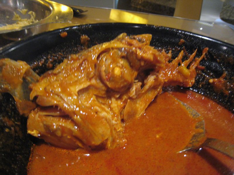 some food is being cooked in a pot with a spoon
