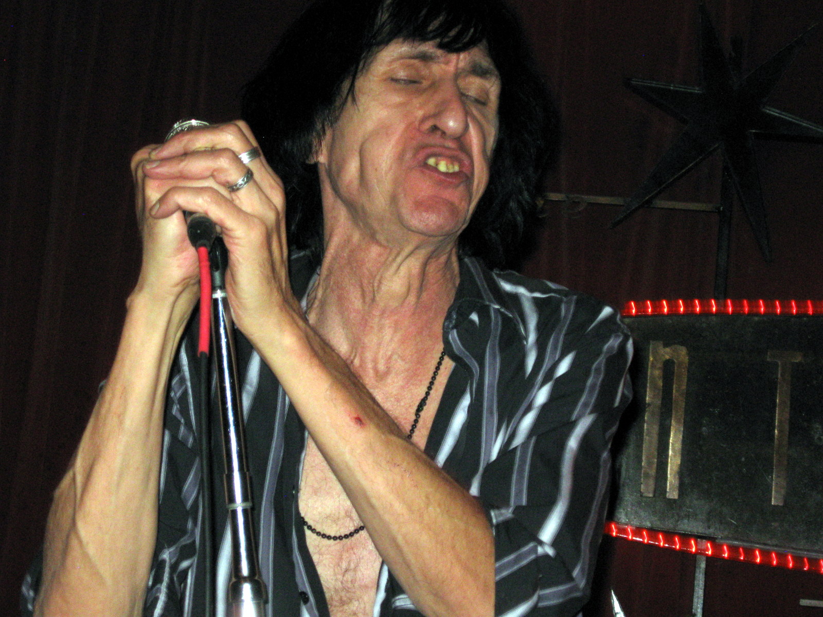 a person on stage with his mouth open