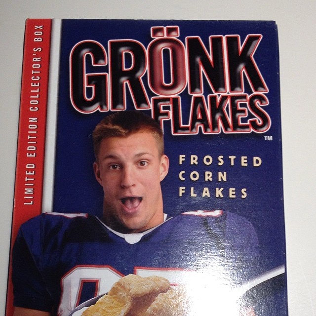 a magazine with a picture of the athlete holding a bread donut
