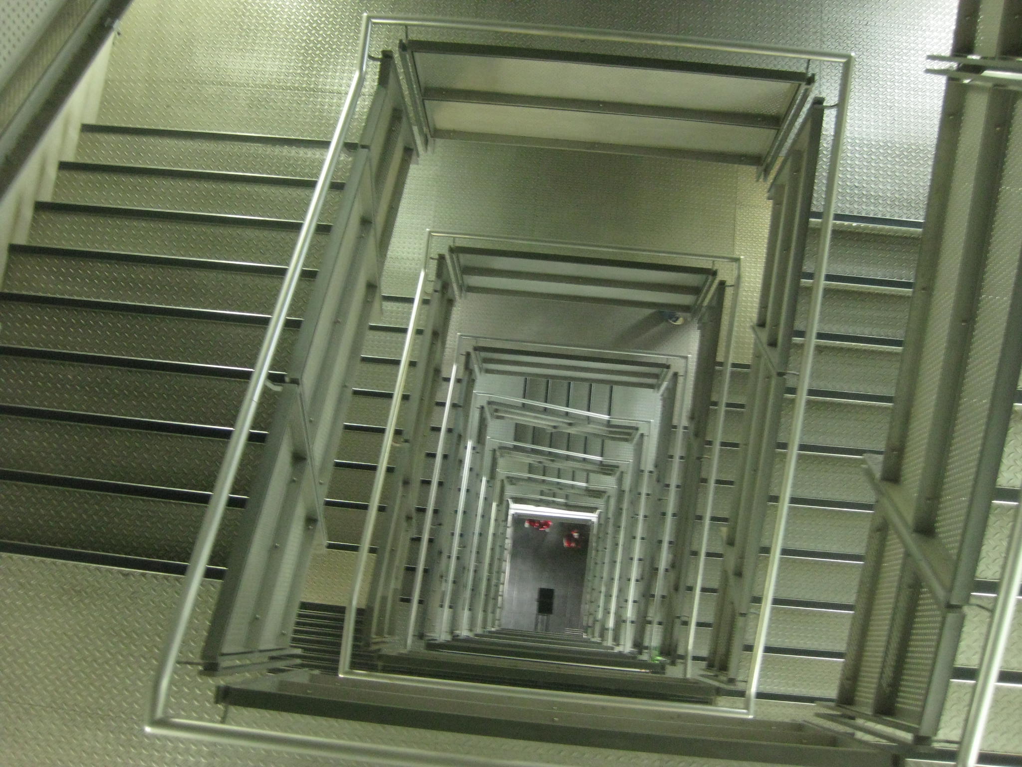 a bunch of stairs are lined up in an atrium